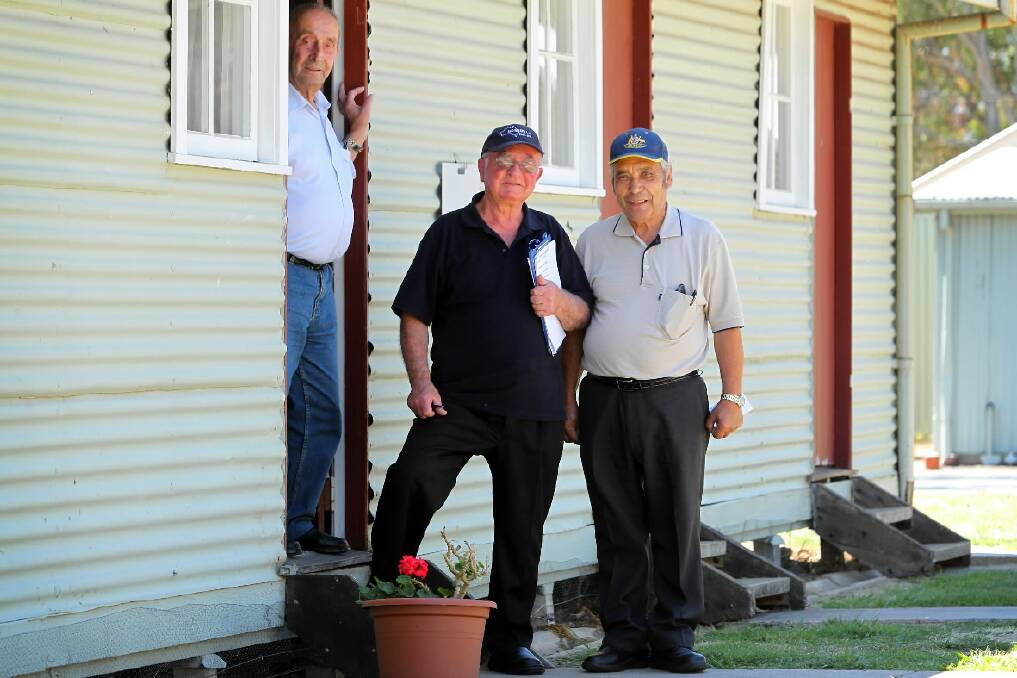 Costa Gragoropoulos, Theo Emmanouilidis and George Dikeakos at the former Bonegilla Migrant Reception and Training Centre where they began their new lives. Picture: Matthew Smithwick