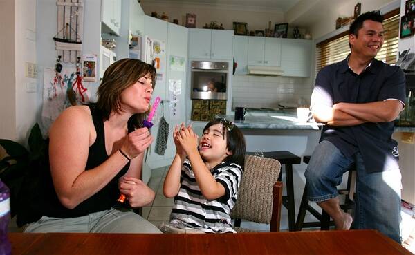 Rebecah and Manuel Gonzalez with their son Coen, who has autism. Picture: NIC GIBSON