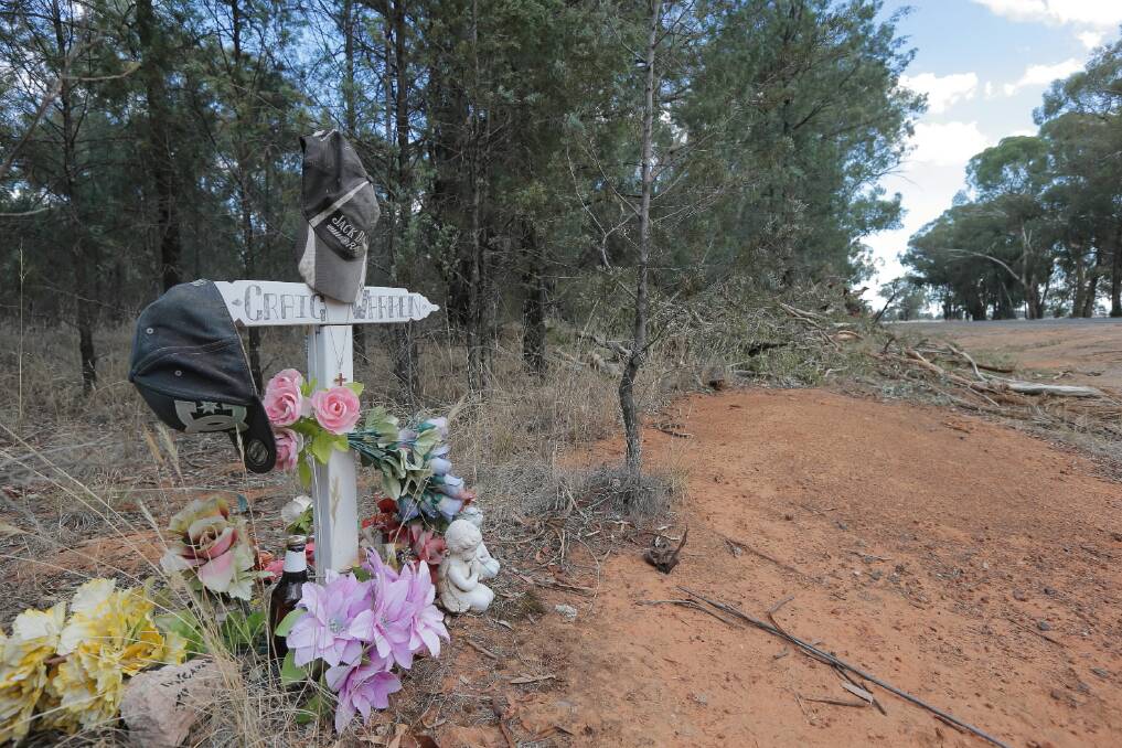 A memorial to some of those killed in crashes along the Hopefield Road provides a sober reminder of why machines are uprooting trees to improve safety.   Pictures: TARA GOONAN and PETER MERKESTEYN