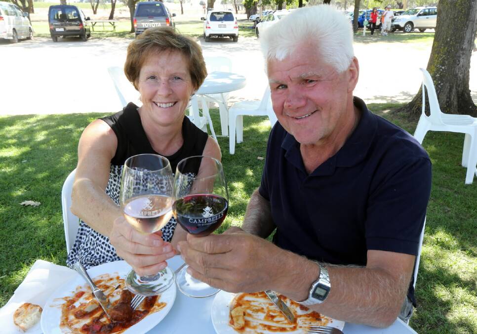Carolyn and John Butko, of Bellbridge, enjoy their wine with a King River Cafe gnocchi with local Italian sausage, olives, capsicum and baby spinach at Campbells Wines, Rutherglen. Pictures: PETER MERKESTEYN