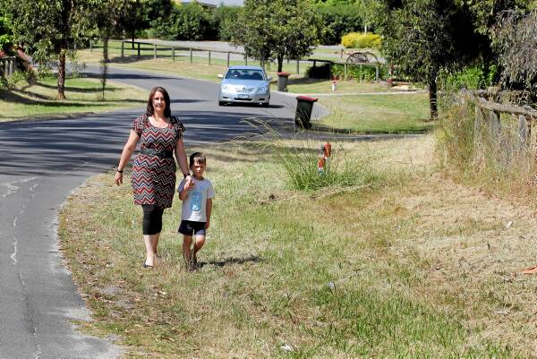 Eryn Phillips with her son, Luke, 4, says the site for Wodonga’s new ambulance station is inappropriate with its close proximity to an aged-care home and a bus stop used by children. Picture: DAVID THORPE