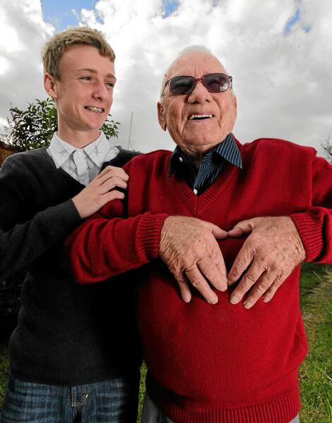 Bryce Mann, 15, with his grandfather Lance Mann, who has survived three heart attacks to celebrate his 80th birthday today. Picture: KYLIE GOLDSMITH