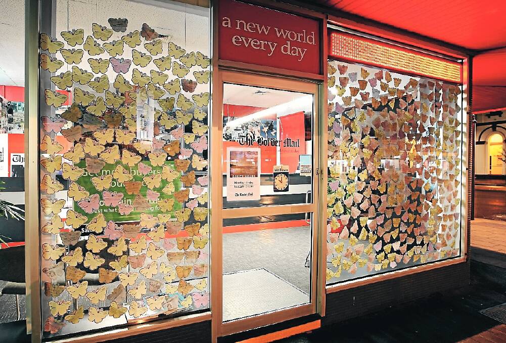 ABOVE: Students from high schools across Albury-Wodonga showed their support in helping the headspace campaign soar yesterday.
Picture: JOHN RUSSELL
LEFT: Butterflies thrived in Dean Street, Albury, yesterday in The Border Mail office.
Picture:
MATTHEW SMITHWICK