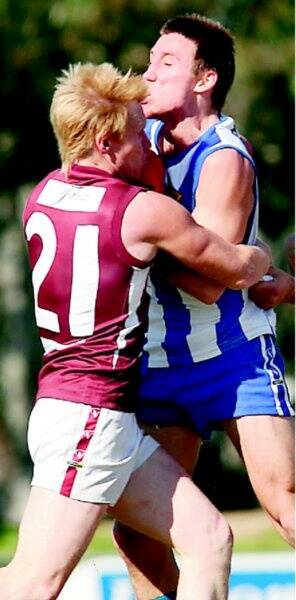 Nick Raines, right, clashes with Dogs coach Jarrod Twitt last year.