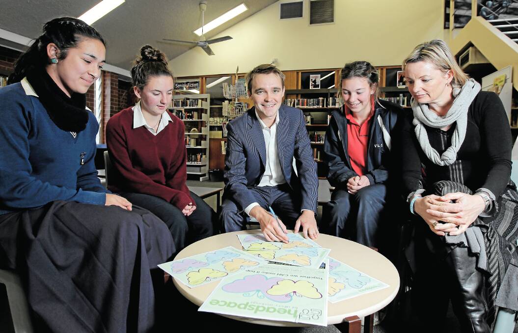 Wyatt Roy signs a butterfly for Emily Glan (Murray High), Paige Gallagher (James Fallon) and Laura Collins (Victory Lutheran) and member for Farrer Sussan Ley. Picture: TARA ASHWORTH