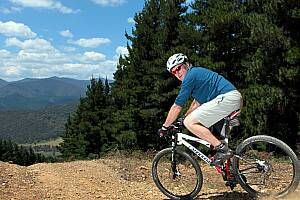 Adventure guide Les Doyle takes in the view from on high at Bright Mountain Bike Park before tackling a downhill run. PICTURE: Kylie Esler.