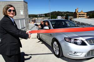 Albury mayor Alice Glachan opens the carpark with other Albury councillors excitedly waiting inside the car.