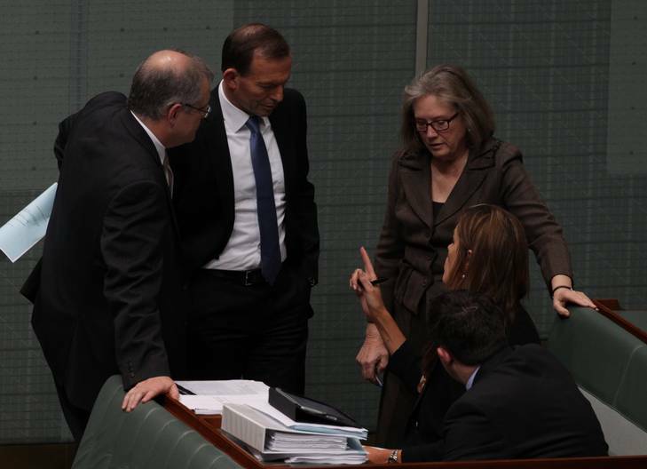 Shadow Immigration Minister Scott Morrison, Opposition Leader Tony Abbott and Judi Moylan speak with advisor Peta Credlin during the debate. Photo: Alex Ellinghausen