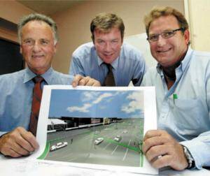 Mann general manager Noel Howard, Bruce Mann and Bunnings chief operations officer Peter Davis with warehouse plans. Picture: PETER MERKESTEYN