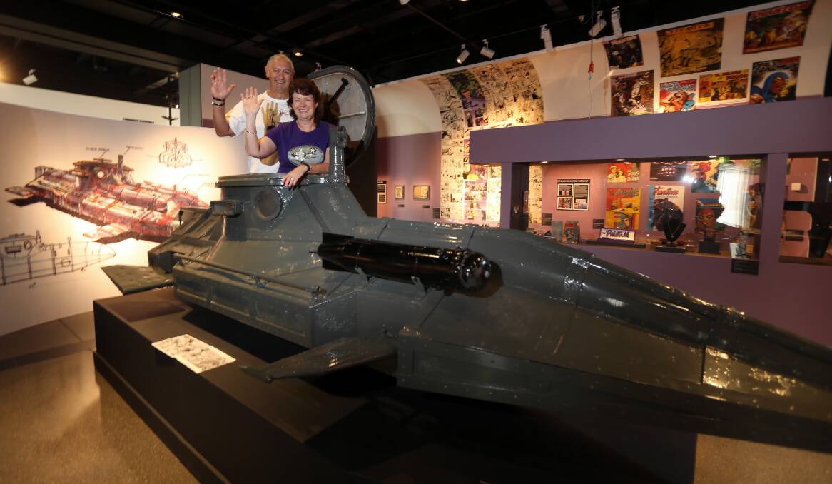 Brad and Joy Peach in their submarine, which was used in the movie The Phantom: Slam Evil and is part of an exhibition at the Albury Library Museum. Picture: PETER MERKESTEYN