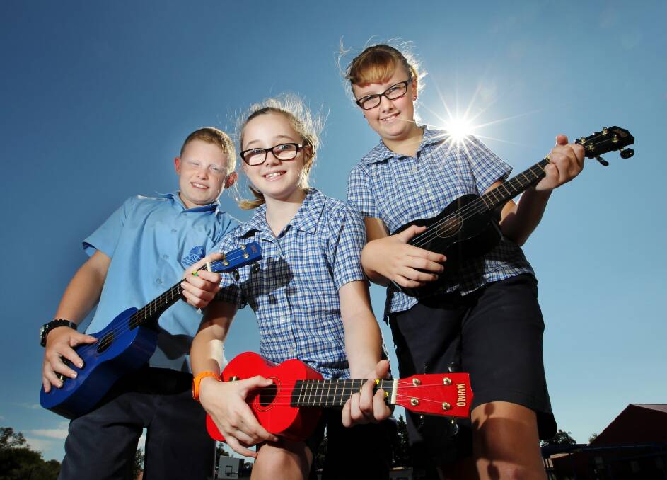 St John’s Lutheran School students Ethan Stead, 11, Imogen Fox, 11, and Meggen Twyford, 11, will enter the new ukulele section in this year’s eisteddfod. Picture: DAVID THORPE