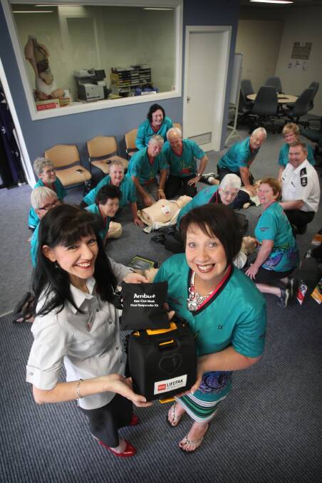 St John Ambulance Albury training centre co-ordinator Helen Chant and Brave Hearts on the Murray secretary Diane Laundess at a defibrillator training session. Picture: Mark Jesser