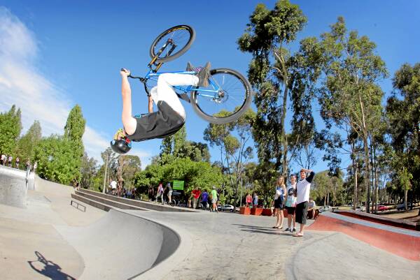 Joel Milich, 21, of Wodonga, does a 360 flip on his bike at Wodonga’s skate park. Picture: TARA GOONAN