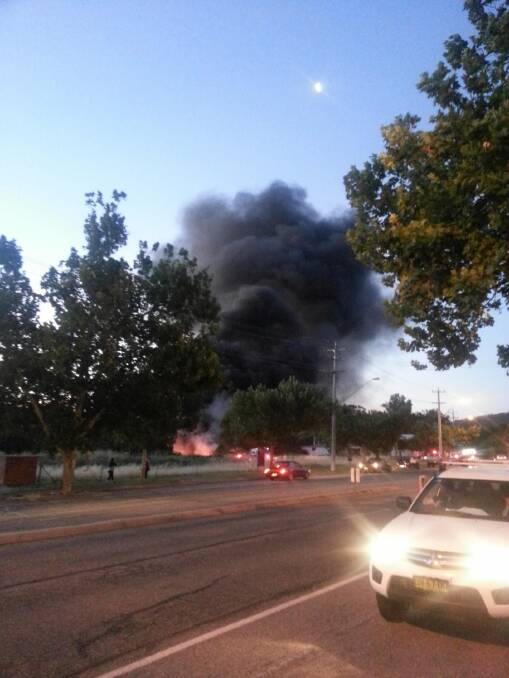 Black smoke billows from a Livermore Street block after $200,000 in equipment was set alight on Tuesday night. Picture: Ben Van Kesteren