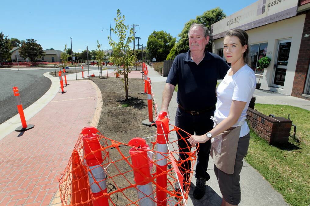 Colin Storey and Olivia Watkins say they have lost 80 to 90 per cent of business as customers have been unable to get to their businesses because of roadworks in Lawrence Street. Picture: DAVID thorpe