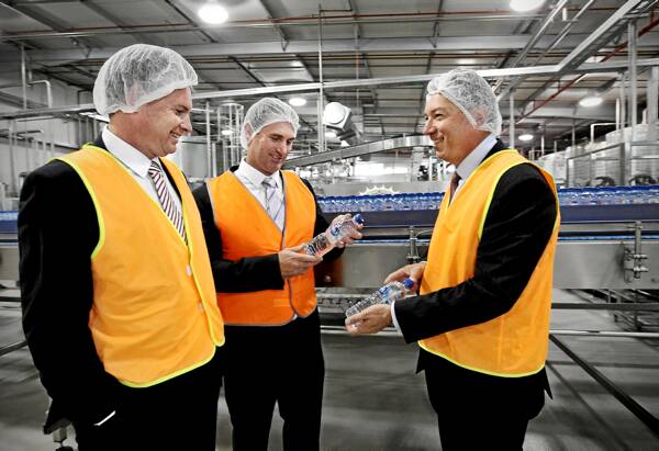 Schweppes strategy director Darryn Wallace, operations manager Steven Pitts, and Schweppes managing director David Beguely in Albury yesterday at the Mountain H2O bottling plant which has been taken over by Japanese company Asahi. Picture: BEN EYLES