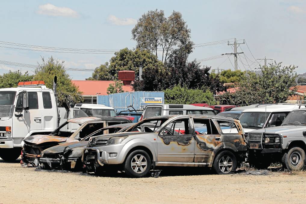 A Holden Senator was set alight in the car yard, the blaze spreading to two adjoining vehicles. Picture: TARA ASHWORTH