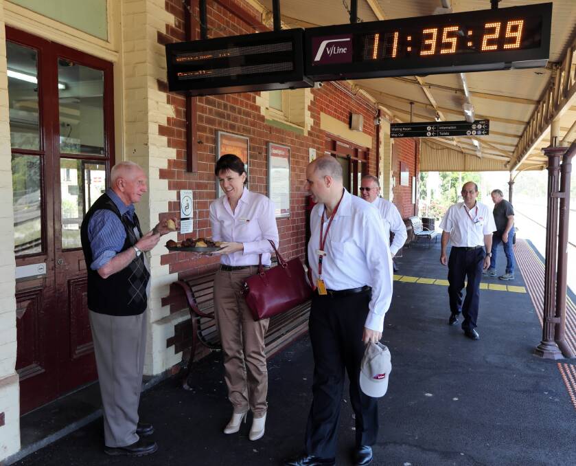 Railway volunteer and former track worker Charlie Mead is met by V/Line’s Carol-Anne Nelson and Theo Taifalos. The clock shows they were more than an hour late to the meeting. Picture: PETER MERKESTEYN