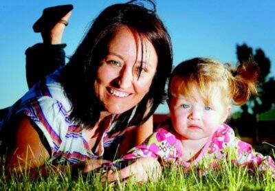 Kym MacLean and daughter Charlie playing at a park near their home. Picture: NIC GIBSON