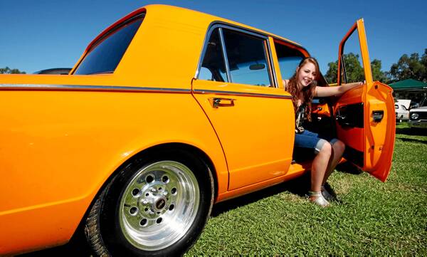 Ashleigh Borg, of Melbourne, with her 1963 Valiant AP5, at Chryslers on the Murray. Ashleigh&rsquo;s father owned the car and brought it to show at Chryslers on the Murray for several years, and since his death, she has continued the tradition.