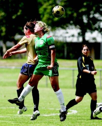 Ellie Brush, in green, in action for Canberra against Newcastle last season. Picture: FAIRFAX
