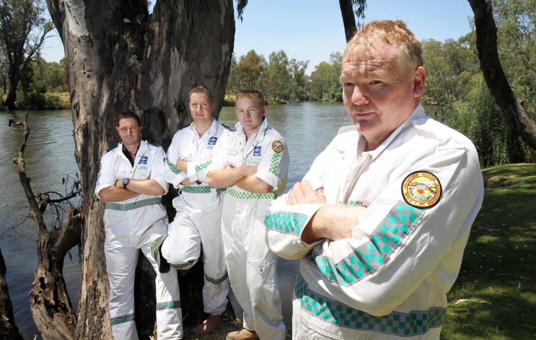 Captain Stuart Dye has the backing of rescue squad members Jamie Conroy, Pete Ritchie and Brendan Dye for the idea of installing life buoys at popular swimming spots such as Albury’s Noreuil Park. Picture: MARK JESSER
