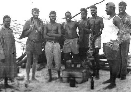 1959 photo showing Michael Fomenko "Tarzan" with the mission natives who rescued him.