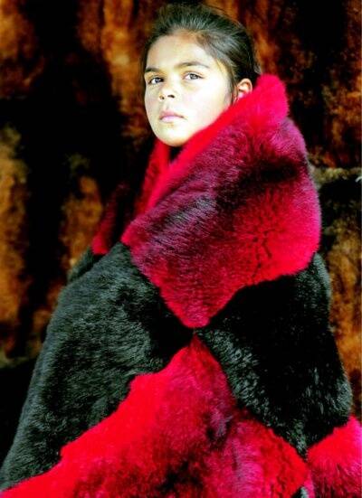 Akira Kelly, 8, of Sydney, wears an Aboriginal possum-skin coat. Pictures: MATTHEW SMITHWICK