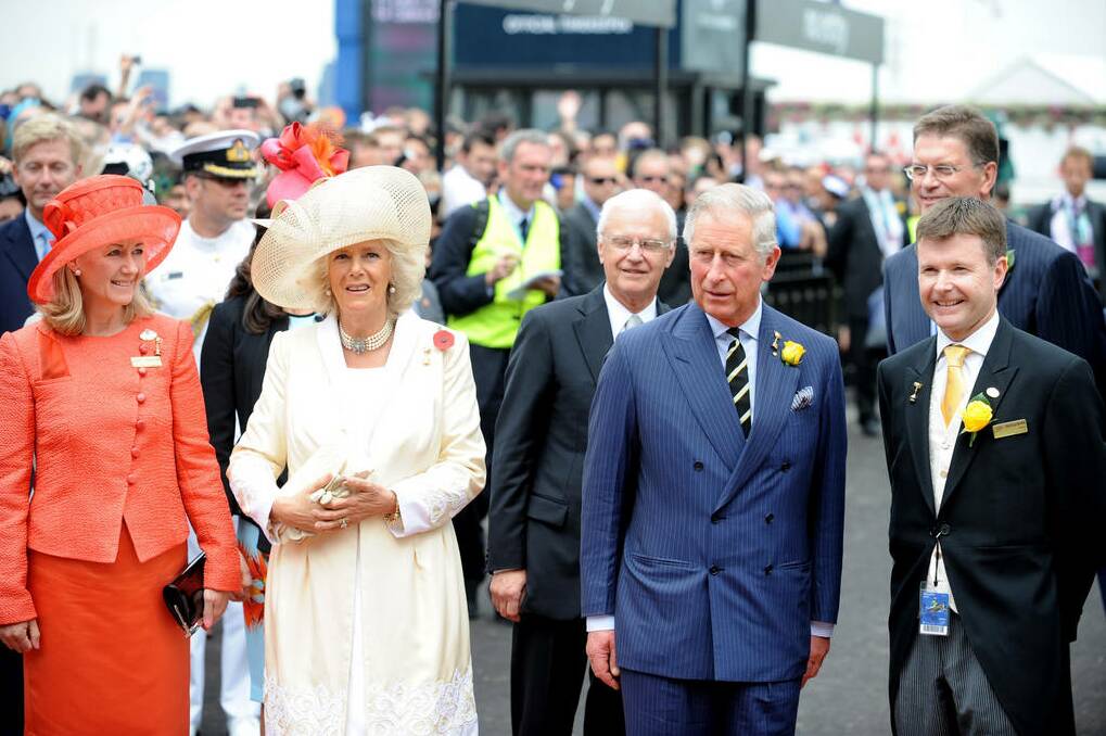Camilla, Duchess of Cornwall and Prince Charles, Prince of Wales are greeted by thousands of racegoers on Melbourne Cup Day at Flemington Racecourse in Melbourne, Australia.