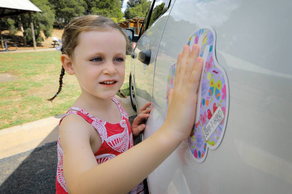 Charlotte Storey, 5, won a competition to design a new ‘Safe-T-Hand’ magnet. Picture: TARA GOONAN