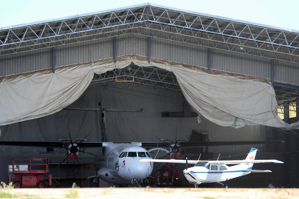 Investigators were at Albury Airport yesterday examining a Virgin plane grounded due to damage.