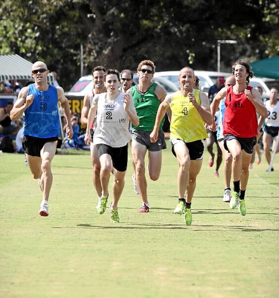Home stretch: Winning the mile-long race was Matthew McDonough (yellow), with Justin Murphy (blue) in second and Michael Marantelli in third.