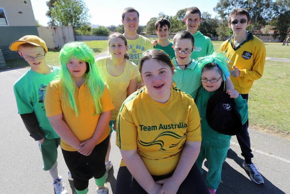 Alannah McKeown, 17, and friends from Belvoir Special School dressed in green and gold as a fundraiser to help get her to next month’s Special Olympics Asia Pacific Games. Picture: Peter MerkESTEYN
