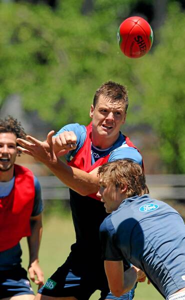 Hamish McIntosh pops a ball over the top during a training drill yesterday at Mount Beauty.
