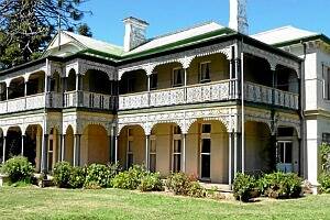 Collendina, with its gracious cast-iron lacework verandah, will be auctioned next month.