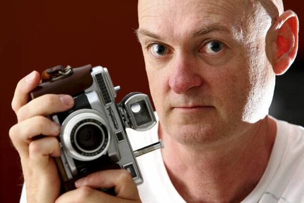 Tim Petts with the camera he used to capture AC/DC in 1976. Picture: MATTHEW SMITHWICK