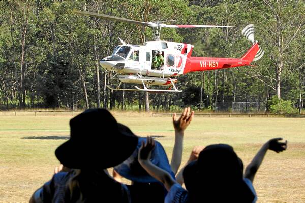 The work of rappel and fire-bombing crews was brought home to Harrietville Primary School pupils yesterday when a DSE Ovens rappel crew brought a helicopter to school. Picture: MATTHEW SMITHWICK