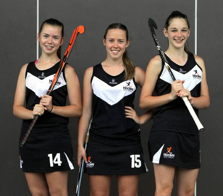 Macey, 13, and Riley Sutherland, 15, along with Eryn Norie, 13, have been selected in state indoor hockey. Picture: MARK JESSER