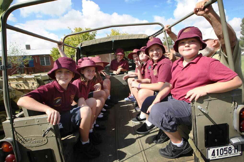 Mulwala primary pupils Jyda House, Ethan Stephens, Danielle Harris and Zali Peters check out the cabin of a 1964 Alvis Stalwart “Stolly”. Pictures: DYLAN ROBINSON