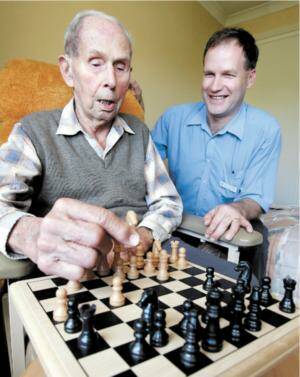 Lutheran Aged Care resident Carl Hunichen keeps his mind active by playing chess with Stephen McCrohan. Picture: KYLIE GOLDSMITH