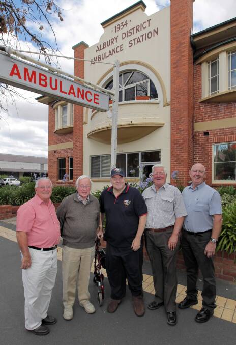 Retired ambulance officers Graham Petrie, Alan Stewart, Geoff Kent, Ted Barber and Bill Williams reminisce outside the old “rabbit warren” station and think a move to Wagga Road in Lavington will be good. Picture: DAVID THORPE