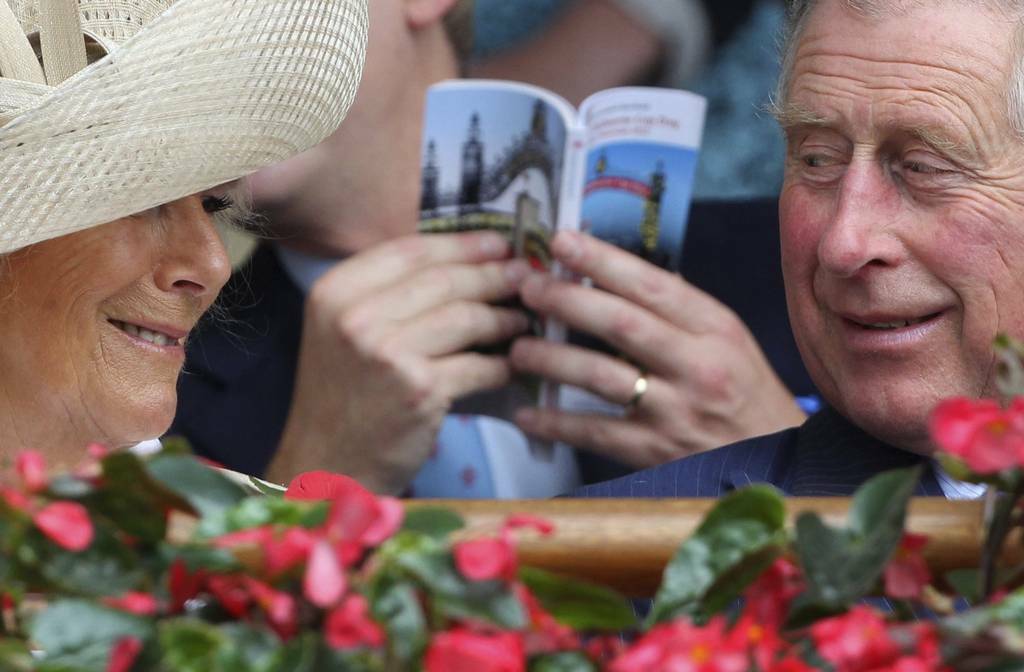 Britain's Prince Charles and his wife Camilla, Duchess of Cornwall, share a light moment before the running of the Melbourne Cup at Flemington race course.