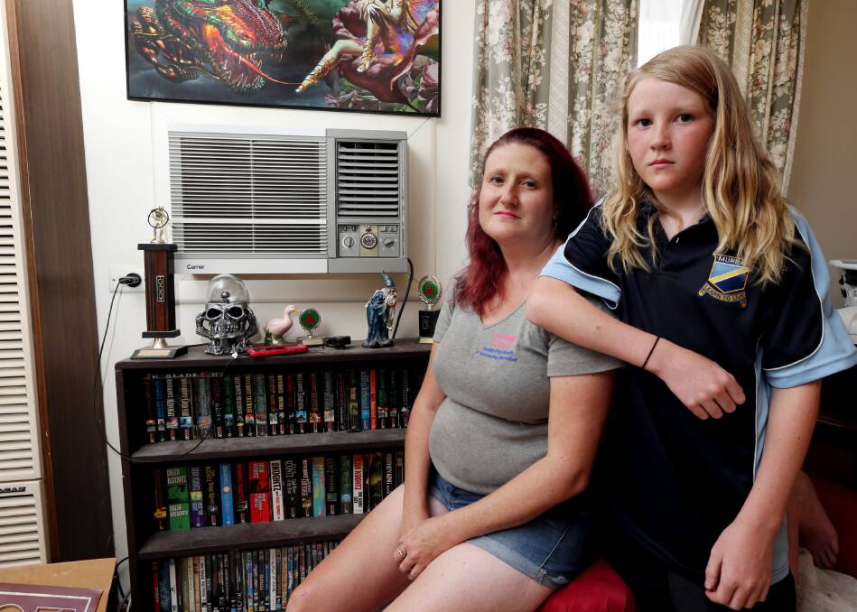 Tracey Cunningham and her son, Dale, 12, have suffered almost four hot weeks without an airconditioner in their Springdale Heights rental property. Picture: Peter Merkesteyn