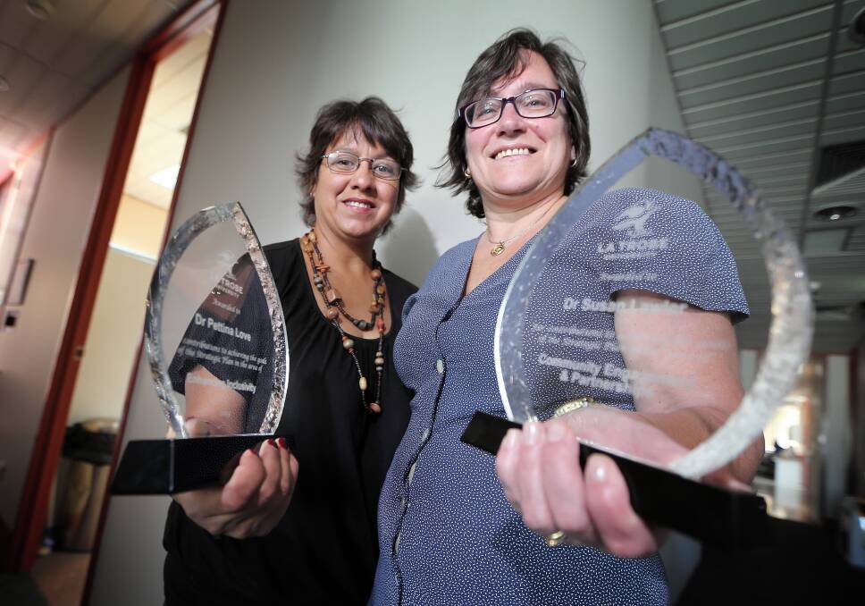 La Trobe University’s Dr Pettina Love and Dr Susan Lawler show off their awards. Picture: JOHN RUSSELL