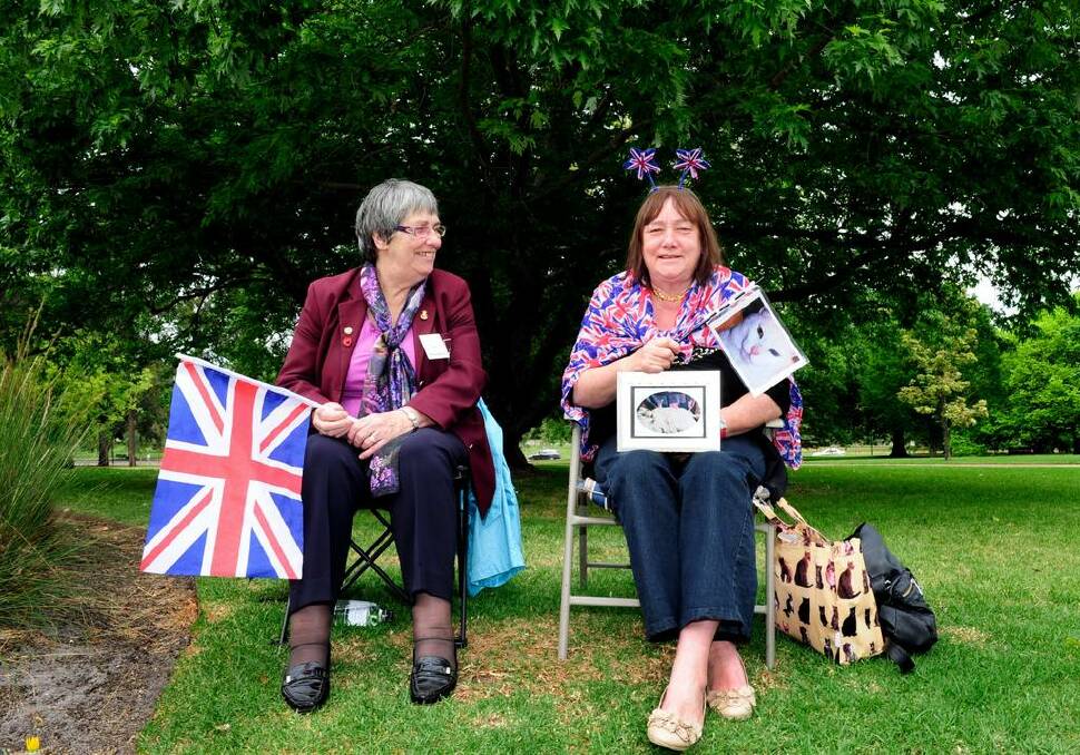 Strangers to each other Jo Green and Dimity Pettifer (who's holding photos of her cat called Camilla) were the only two people to perch themselves outside Government House in Melbourne, aiming to catch a glimpse of Prince Charles and Camilla.
