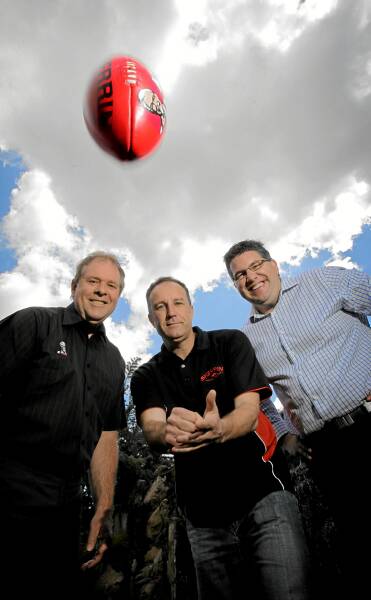 KFC’s Geoff Wright, Sherrin Footballs national sales manager Rod Lawson and O and M general manager Tom O’Connor launch the league’s new Sherrins for next season. Picture: TARA Ashworth