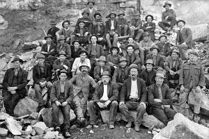 Workers without any safety gear or clothing pose for a photograph at the dam quarry in the 1920s.