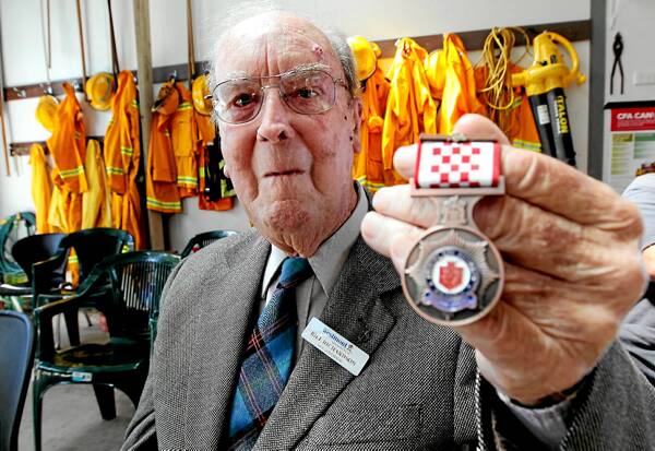Bill Richardson shows his 60-year service medal from the Country Fire Authority. Pictures: JOHN RUSSELL