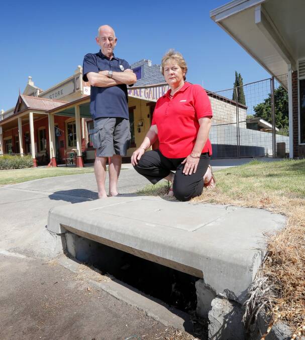 Riverside Caravan Park manager Garry Webster and Walwa store owner Joyce Hunt want Towong Council to find the source to the town’s stench and put a lid on it — soon. Picture: TARA GOONAN