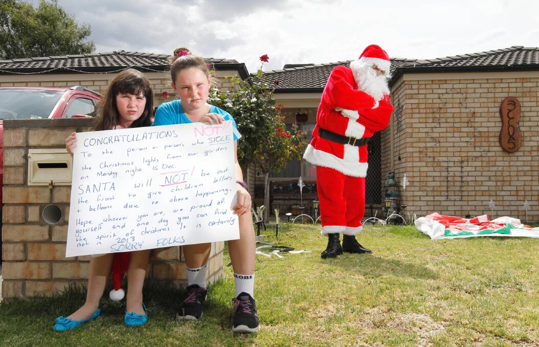 Al Skinner will not appear as Santa this year after thieves stole Christmas lights from his Wodonga home. Zoey Nolan, 8, and Hayley Nolan, 10, are also now unable to volunteer as helper elves. Picture: BEN EYLES